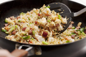 Fried Rice with shrimp and roast pork in a wok.