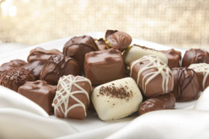 Chocolate collection on a silk and shiny background