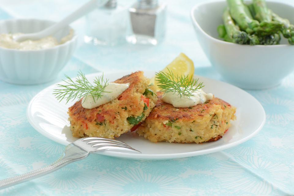 two crab cakes with tartar sauce